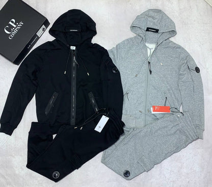 C.P. Company Diagonal Raised Fleece Full-Zip Tracksuit Featuring Goggle Hoodie and Matching Sweatpants with brand's Signature "Lens" Detail on a Sleeve & Pocket
