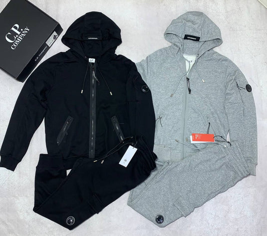 C.P. Company Diagonal Raised Fleece Full-Zip Tracksuit Featuring Goggle Hoodie and Matching Sweatpants with brand's Signature "Lens" Detail on a Sleeve & Pocket