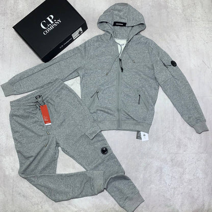 C.P. Company Diagonal Raised Fleece Full-Zip Tracksuit Featuring Goggle Hoodie and Matching Sweatpants with brand's Signature "Lens" Detail on a Sleeve & Pocket