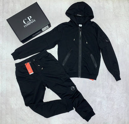 C.P. Company Diagonal Raised Fleece Full-Zip Tracksuit Featuring Goggle Hoodie and Matching Sweatpants with brand's Signature "Lens" Detail on a Sleeve & Pocket