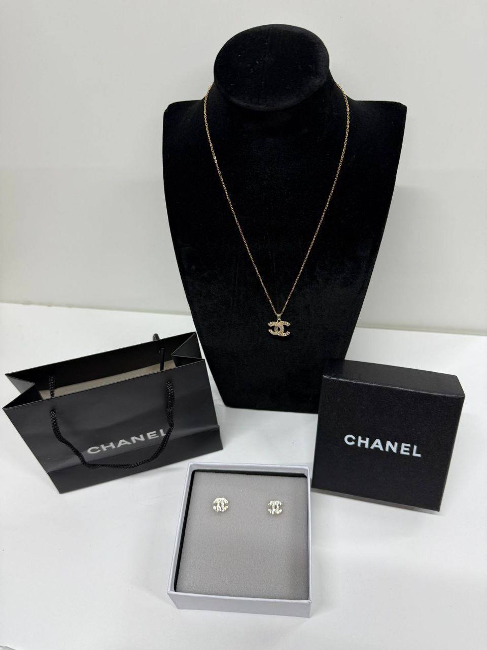 photo 5825510636492885704 y 8e77acd1 a569 40bb 9c20 cd251beb87a3 Chanel Classic CC crystal necklace stud earrings silver AAA replica UK - women's designer reps sale