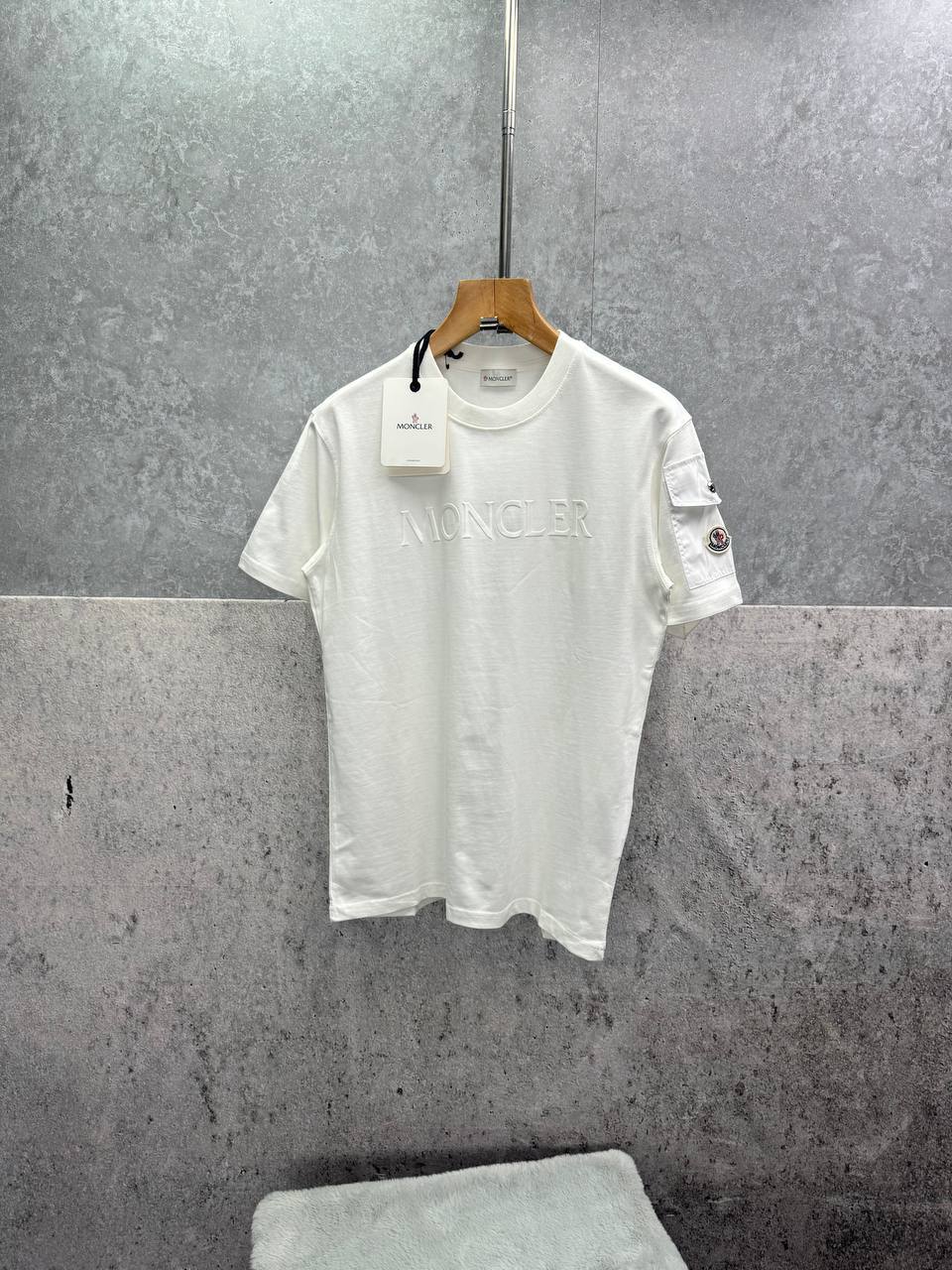 photo 5828132314595134656 y Moncler Embossed Logo Cotton Jersey Sleeve Pocket t-shirt 2 colours AAA replica UK - men's women's reps