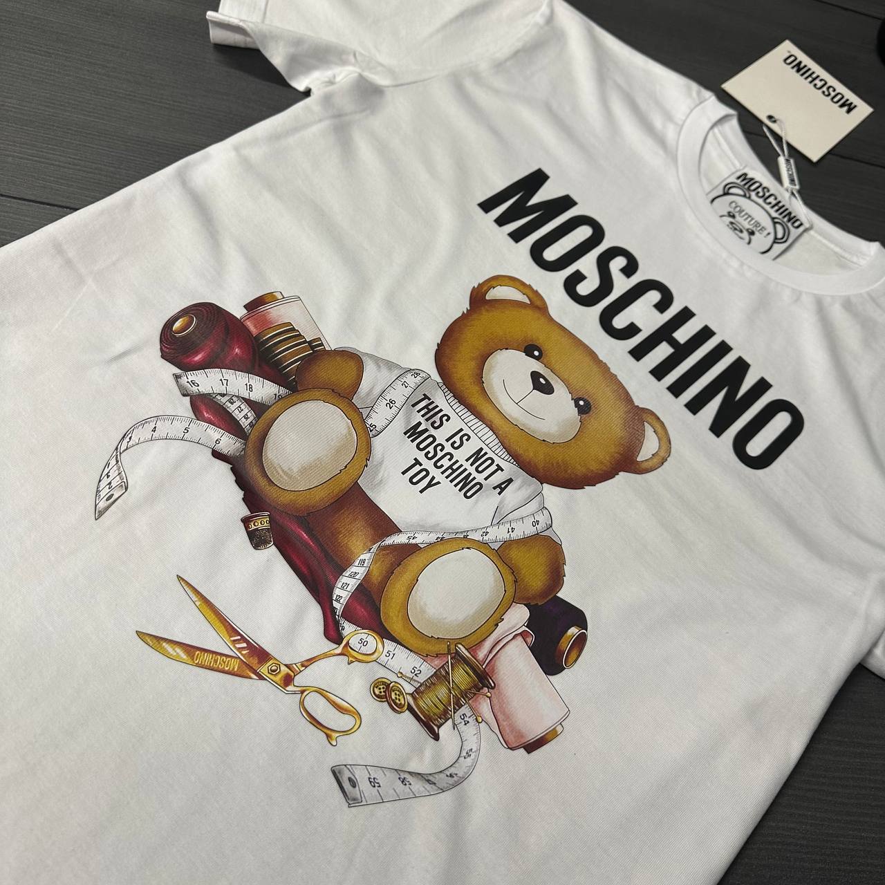 photo 5839087238568938966 y 6.jpg Moschino Sartorial Teddy Bear Short Sleeve Men's Women's T-Shirts in 2 Colors Reps Sale UK Best Quality AAA Replica