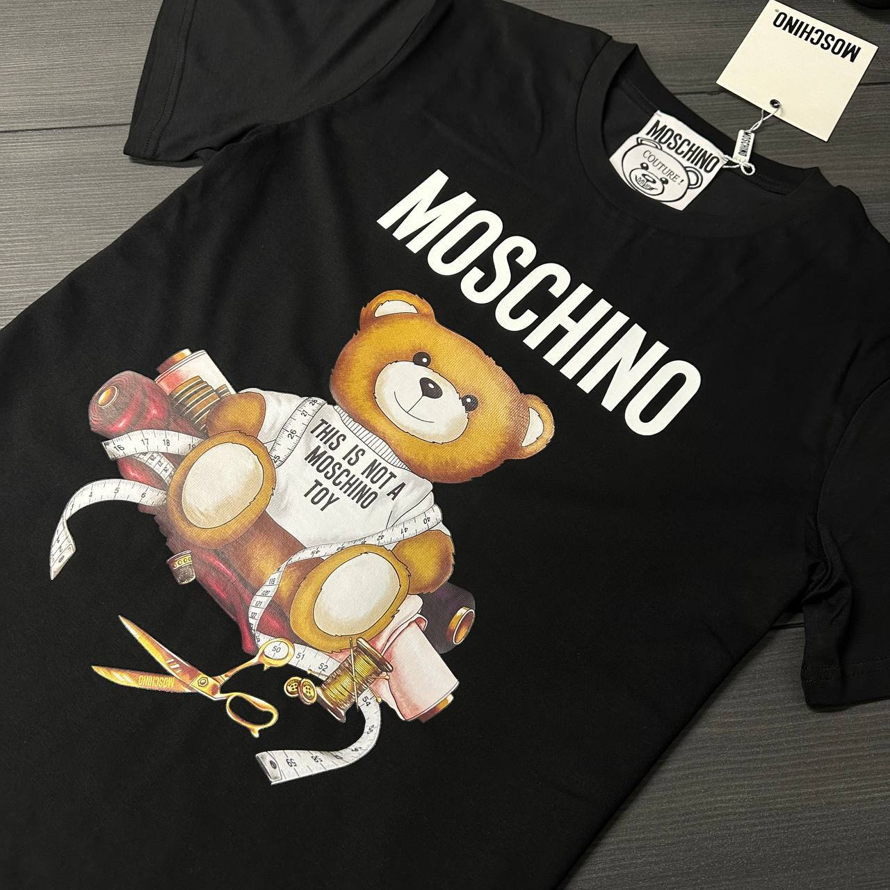photo 5839087238568938969 y 6.jpg Moschino Sartorial Teddy Bear Short Sleeve Men's Women's T-Shirts in 2 Colors Reps Sale UK Best Quality AAA Replica